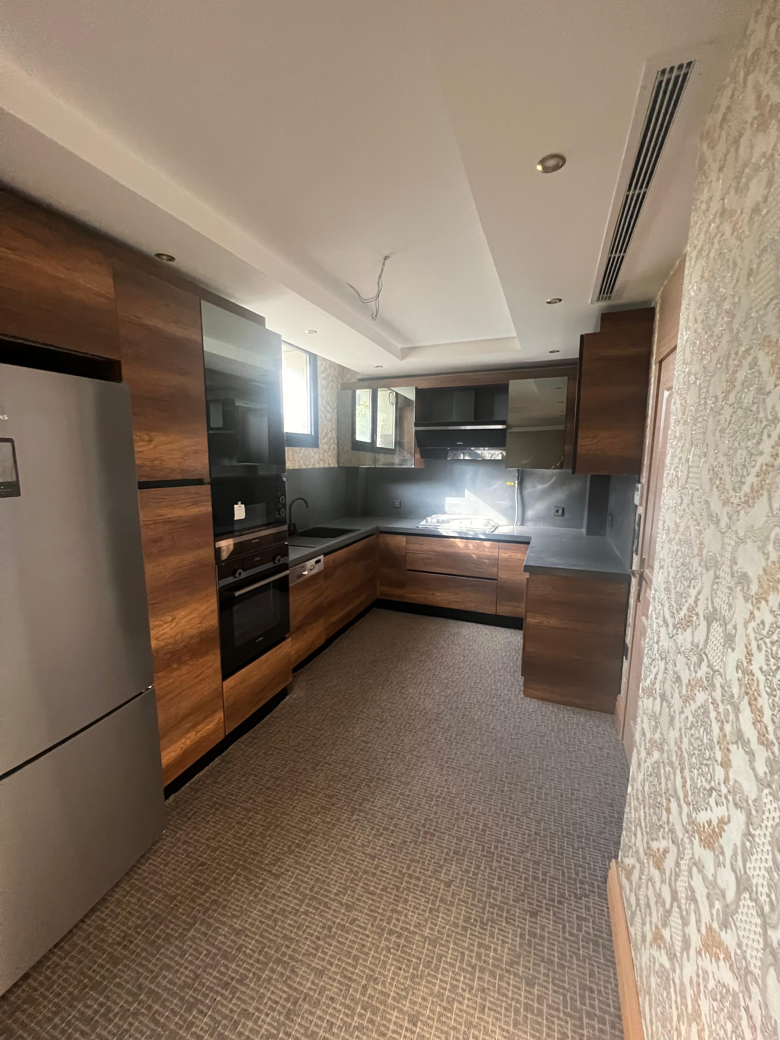 Villa E walnut kitchen with Siemens appliances